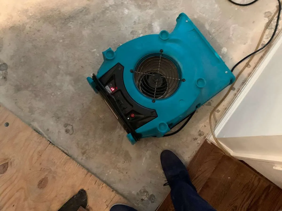 Air mover drying subfloor during Commercial Water Damage Restoration in Notre Dame